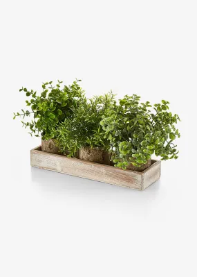 Green artificial plant on tray